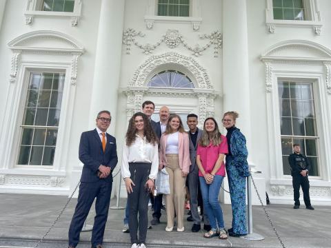 Students stand in front of the White House