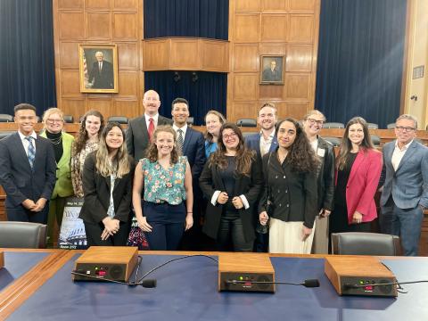 Students standing in a committee room