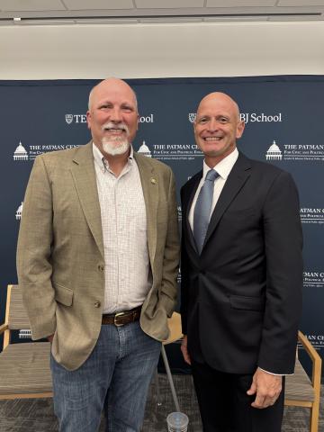 Chip Roy standing smiling with The LBJ School Dean