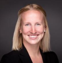 Headshot of a blonde woman with short hair