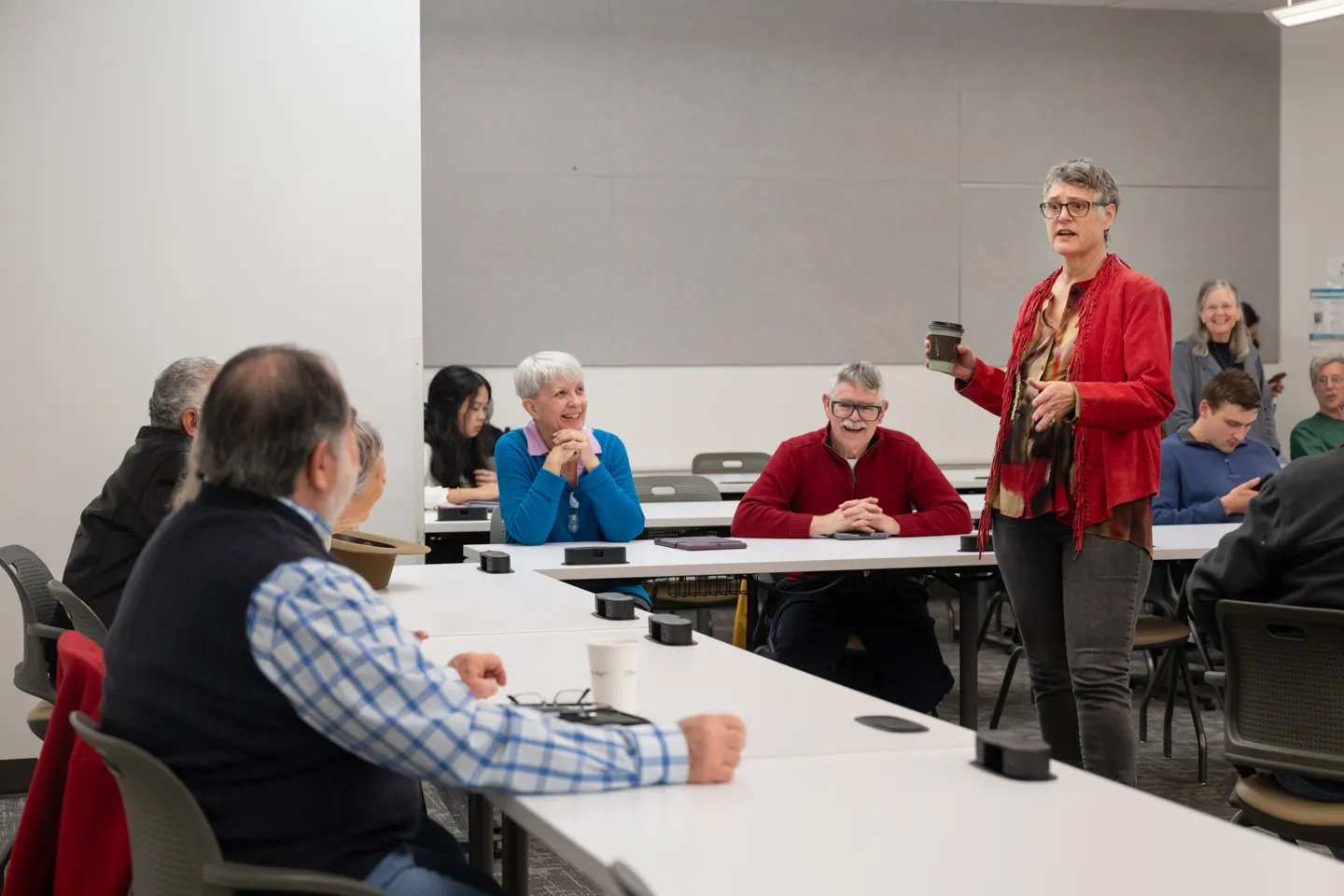 Sarah Eckhardt speaks to a group of people.